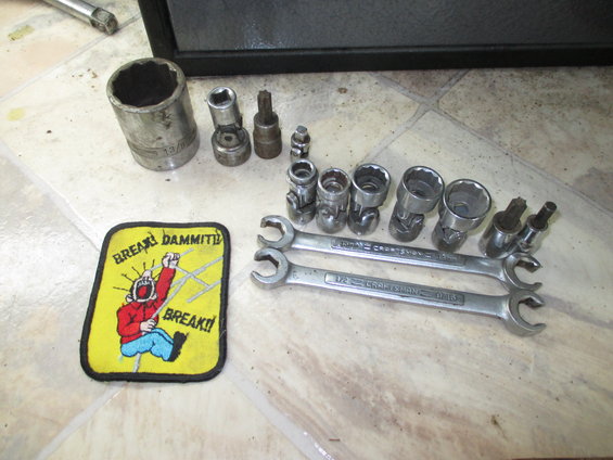 Tool set with sockets, wrenches, and a 'Break Dammit! Break!' patch