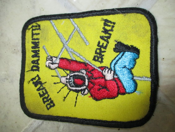 Yellow embroidered patch with cartoon character saying 'DAMMIT!' and 'BREAK!'