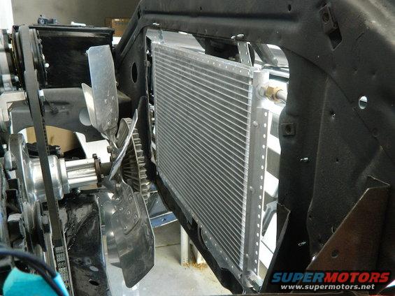 Radiator and fan assembly in a vehicle engine bay