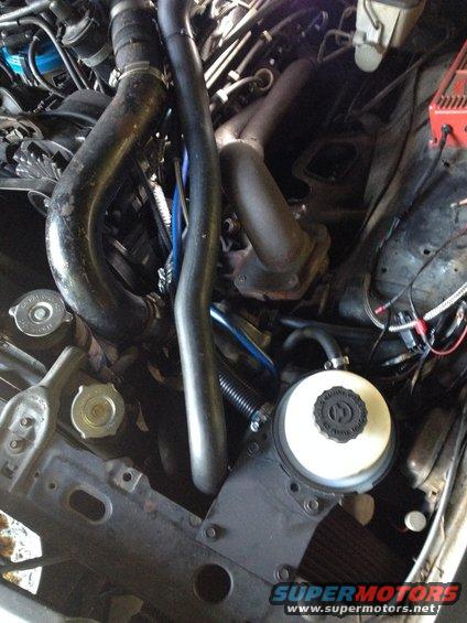 img_1513.jpg Complete install. Took a few cycles to get the air bled out of the pump and gear but it seems to work fine. I hope it holds up; there's too much time in those brackets for me to want to start over with another reservoir.

Half of the feed line to the pump is the power steering return line from a 1990 Volkswagen Golf 1.8 diesel. The other half is just 3/4&quot; oil rated silicone hose.