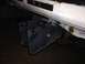 1990 Mitsubishi Montero - A custom bumper bracket is bolted to the frame of a white vehicle, showing signs of rust.