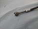 1976 Ford Ranchero - This image shows a close-up of a vehicle's air conditioning hose with a metal fitting attached.