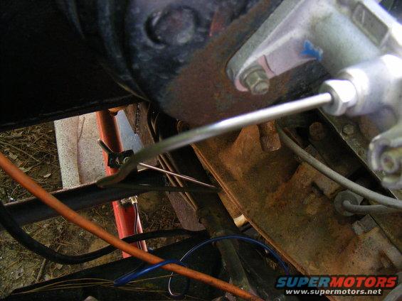 Close-up of a vehicle's brake master cylinder and associated lines