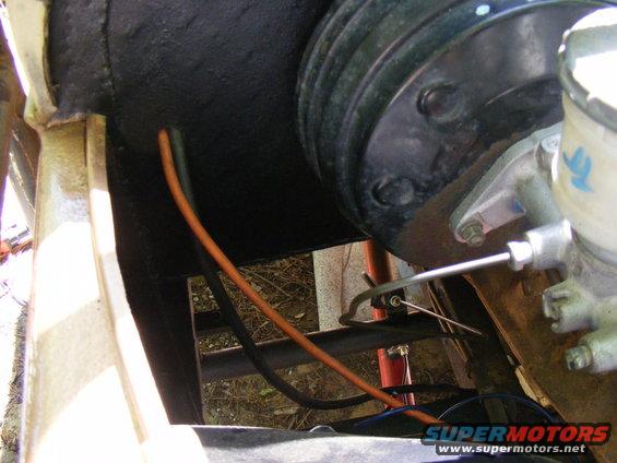 Brake booster and master cylinder assembly with orange and black wires