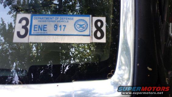 Department of Defense registered vehicle sticker with '3 ENE 917 8' visible