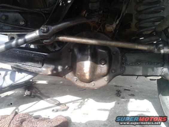 driver side axle that is getting closet far from over, but is on its own weight. the beam has been reinforced and should never have a problem of bending. I got my 8-lug knuckle, tierod flip, Dana 50 4.10 third member in along with a 5.5" Deaver coil and very heavy duty tierods. using ProComp  6" drop brackets and extended arms