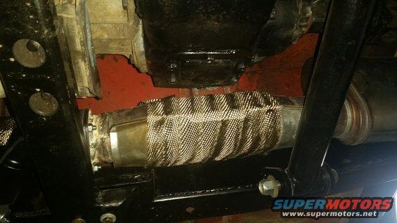 Exhaust pipe with heat wrap and Supermotors.net logo