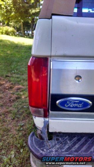 Rear corner of a 1995 Ford Bronco, showing the taillight and Ford emblem
