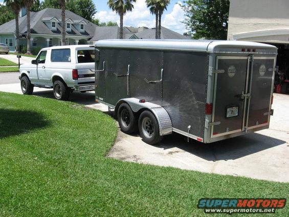 img_0333.jpg Wells cargo dual axle enclosed trailer with a gutter machine mounted inside. The PO had the roof chopped and lowered to fit in a garage.