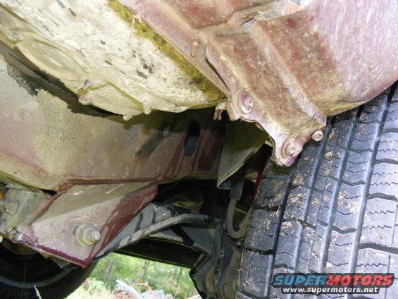 Undercarriage of a 1978 Ford Bronco showing frame and tire