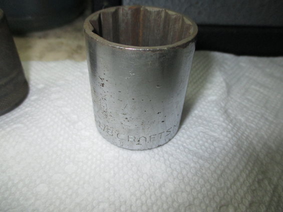 close-up of a metal socket wrench part with 'CRAFTSMAN' visible