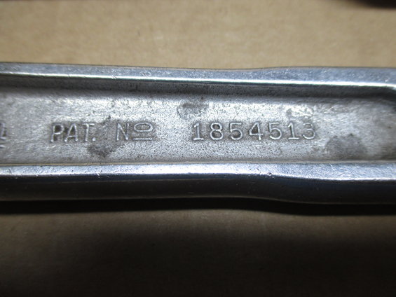 Metal part with stamped text "PAT. NO 1854513"
