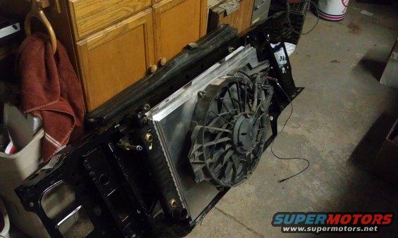 Radiator and electric fan assembly removed from a vehicle