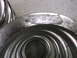1957 Ford Ranchero - A part number is stamped onto a metal spring, likely a suspension component.