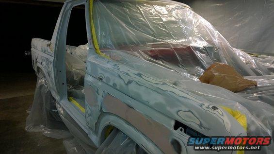 1983 Ford Bronco bodywork in progress, covered in plastic sheeting and primer