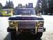 1979 Ford Bronco - Front view of a 1979 Ford Bronco parked in front of a Gasco station.