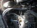 1979 Ford Bronco - Close-up view of an engine bay, showing various mechanical components and wiring harnesses.