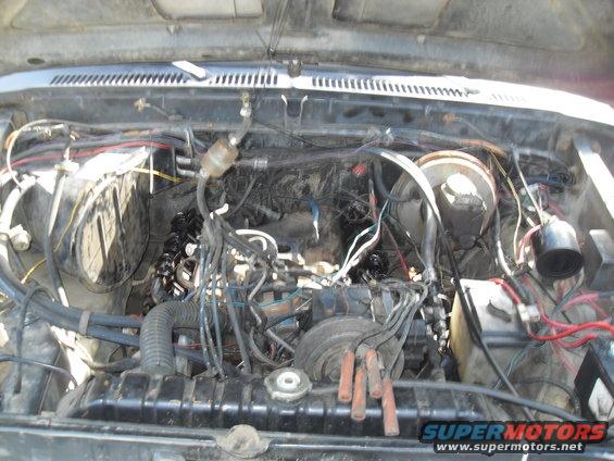 Engine bay with visible wiring and engine components