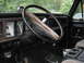 1979 Ford Bronco - Interior view of a 1979 Ford Bronco, highlighting the dashboard and steering wheel.