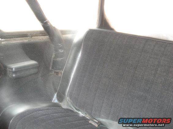 Vehicle interior showing a seat and roll bar