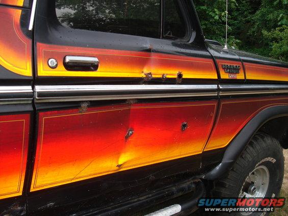 1979 Ford Bronco side with bullet holes and gradient paint