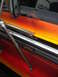 1979 Ford Bronco - Rust is visible on the door of this vehicle, which features a red, orange, and yellow flame graphic.