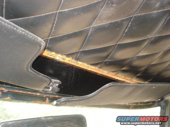 Interior headliner with diamond stitching and exposed wood trim