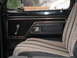 1979 Ford Bronco - Interior view of a 1979 Ford Bronco, showing the door panel and seat upholstery.