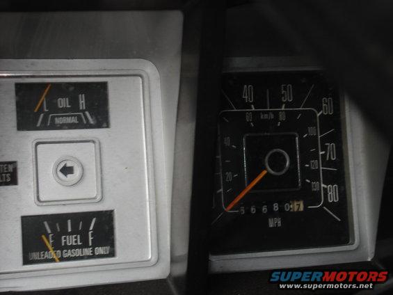 1979 Ford Bronco interior gauges showing oil pressure, fuel level, and speedometer reading 56680.7 MPH