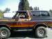 1979 Ford Bronco - Ford Bronco from the late 1970s features a distinctive two-tone paint job with a gradient effect.
