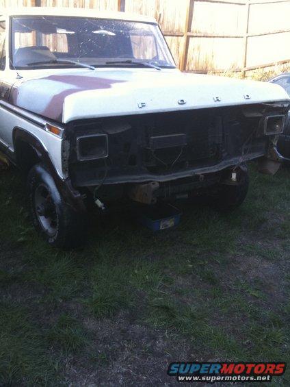 1978 Ford Bronco front end with grille removed, hood has primer spots