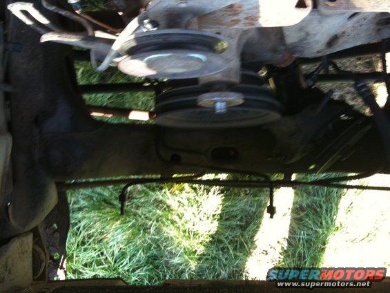 Engine pulleys and belts visible from underneath