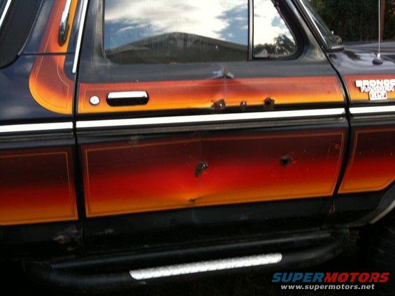 1979 Ford Bronco side panel with custom flame graphics and dents