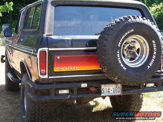 1979 Ford Bronco rear with spare tire and red/yellow tailgate panel