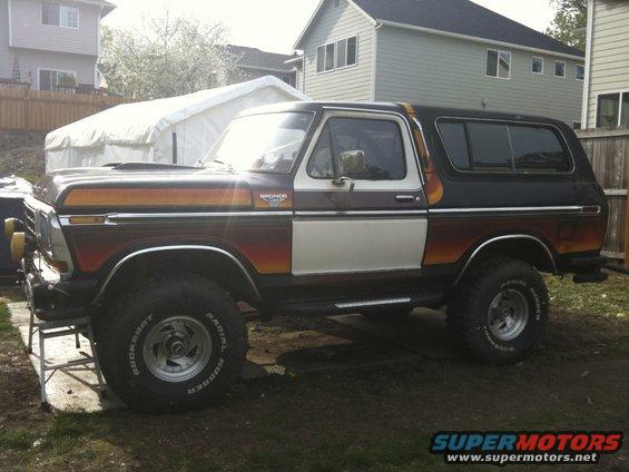 1979 Ford Bronco side view with wood paneling and racing stripes