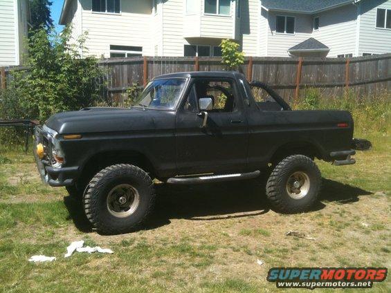 1979 Ford Bronco side view, black with off-road tires