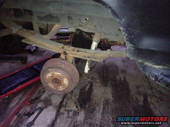 1979 Ford Bronco rear axle with leaf springs and shock absorber, drum brake visible