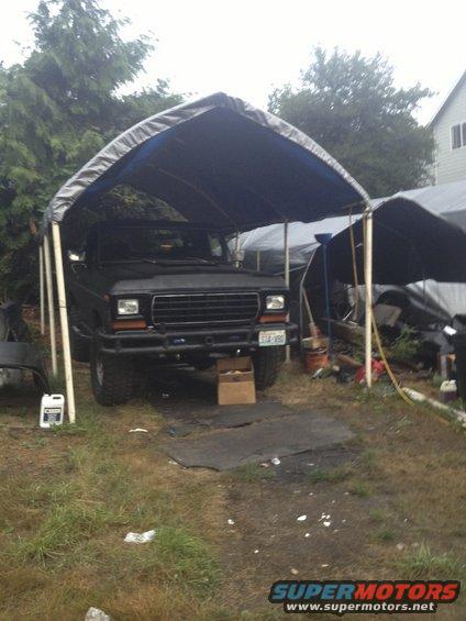 1979 Ford Bronco front view under tarp, license plate 334-VBO