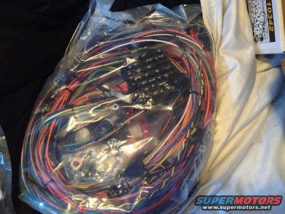 New wiring harness in plastic packaging, with many colored wires and connectors
