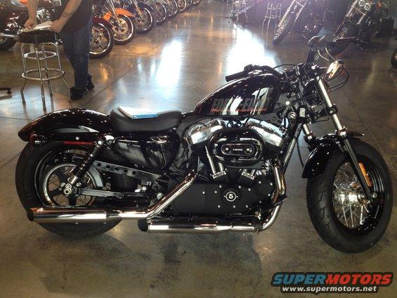 Black Harley-Davidson motorcycle side view with 'FORTY-EIGHT' on the tank