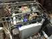1961 International Scout 800 - The engine bay of a custom-built off-road vehicle, a V8 engine and a large aftermarket radiator.