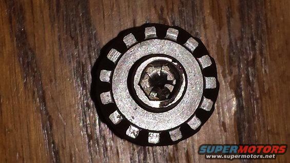 Metal cap with hex bolt and serrated edge