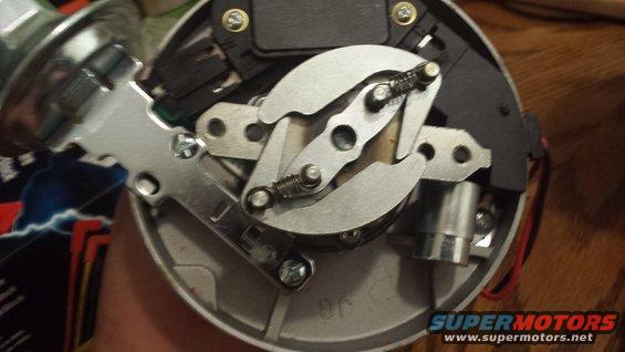 Close-up of a distributor with visible springs and metal components