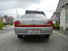 1999 Ford Fairlane - Rear view of a silver sedan, distinctive red taillights and a license plate.