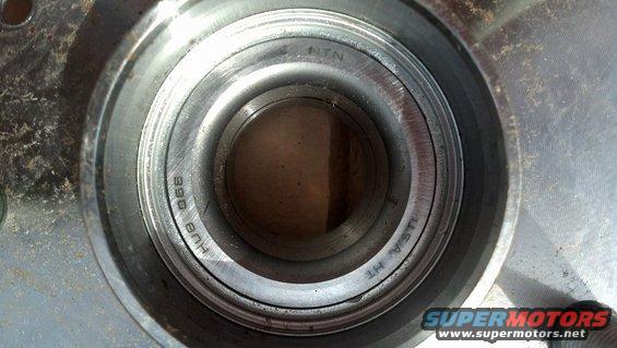 Close-up of a wheel bearing assembly with 'NTN' and 'HUB 066' markings