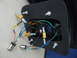 2003 Audi A6 - Close-up view of the internal wiring and components of a car light assembly, including resistors and bulb sockets.