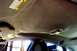 2000 Ford Taurus - The headliner in this vehicle is peeling and cracking, indicating wear and potential need for repair.