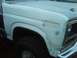 1986 Ford Bronco - This Ford truck is undergoing body repairs, with primer and filler visible on the fender and fender.