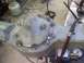 1986 Ford Bronco - A differential housing is shown on a workbench, undergoing modifications with welding.
