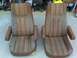 1986 Ford Bronco - Pair of vintage bucket seats, likely from a truck or SUV, displayed outdoors.